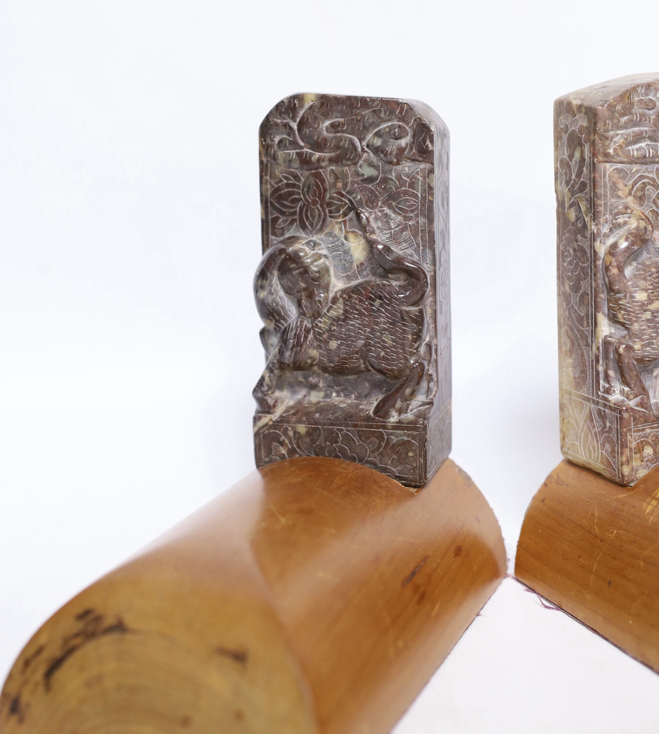 A pair of Chinese soapstone bookends, each 15cm wide